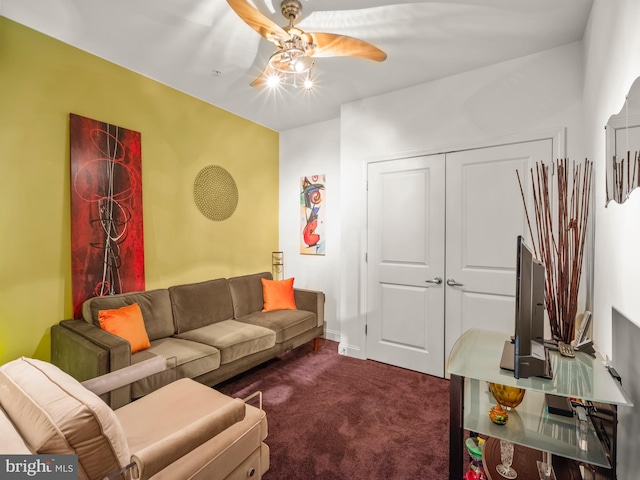 carpeted living room with ceiling fan