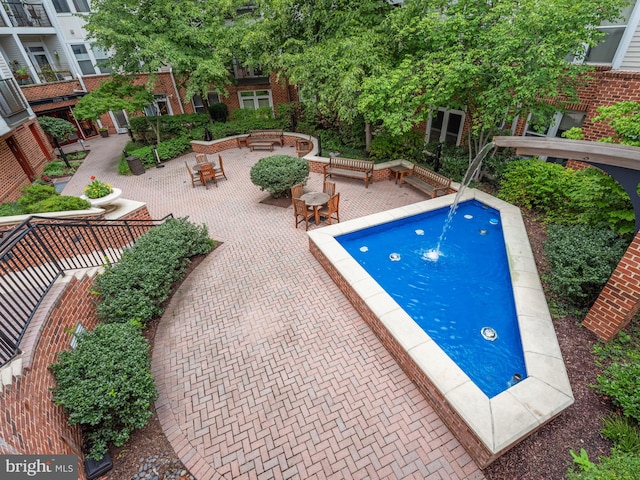 view of swimming pool featuring a patio