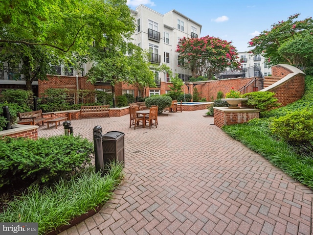 view of property's community with a patio area