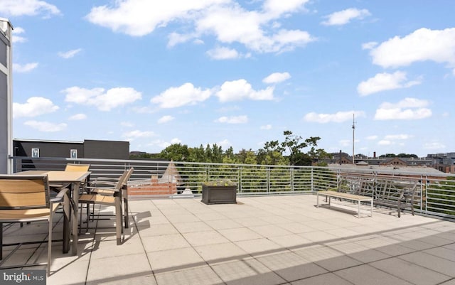 view of patio featuring a balcony