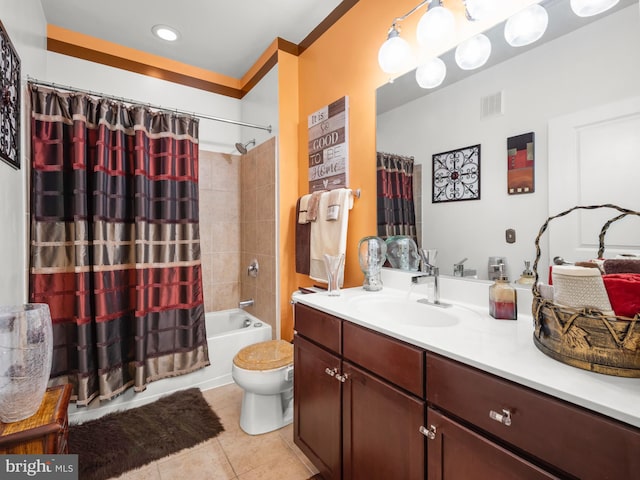 full bathroom featuring tile patterned flooring, vanity, toilet, and shower / tub combo with curtain