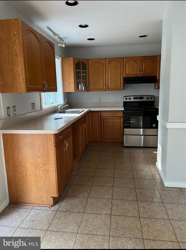 kitchen with stainless steel electric range oven and sink