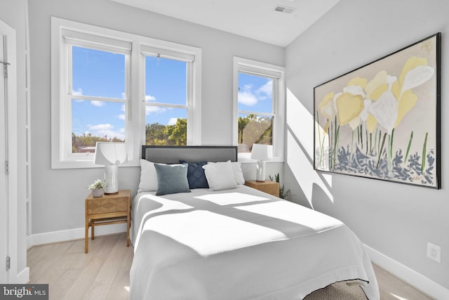 bedroom with light wood-type flooring