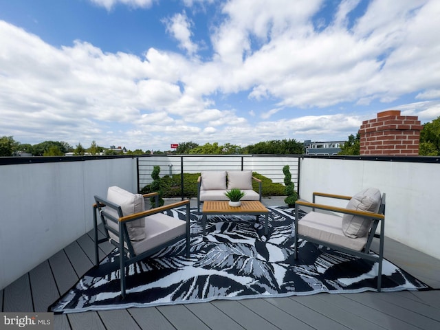 wooden deck featuring outdoor lounge area