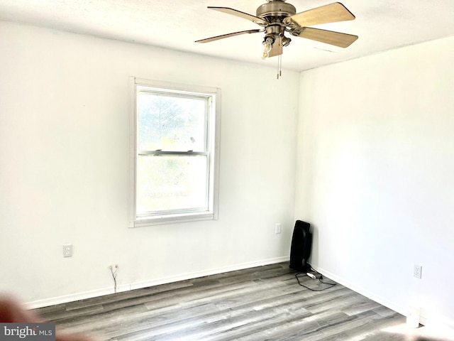 empty room featuring ceiling fan and light hardwood / wood-style floors