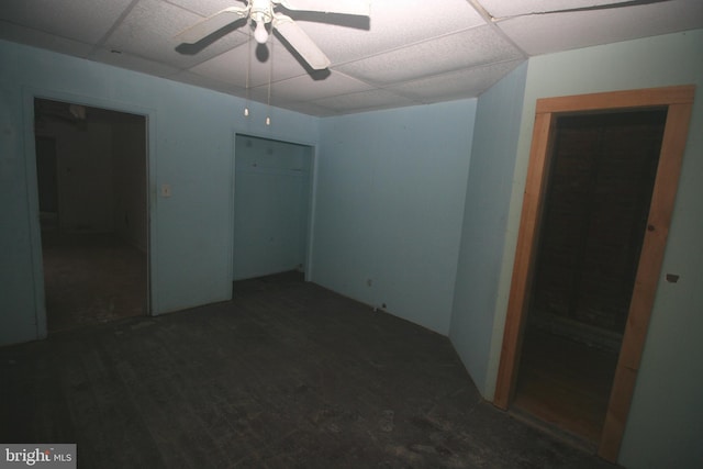 unfurnished bedroom featuring a paneled ceiling and ceiling fan