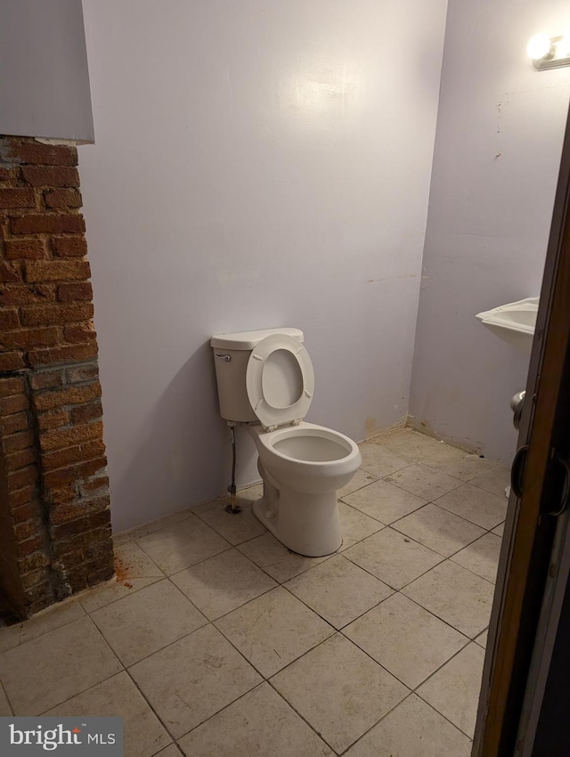 bathroom with tile patterned floors and toilet