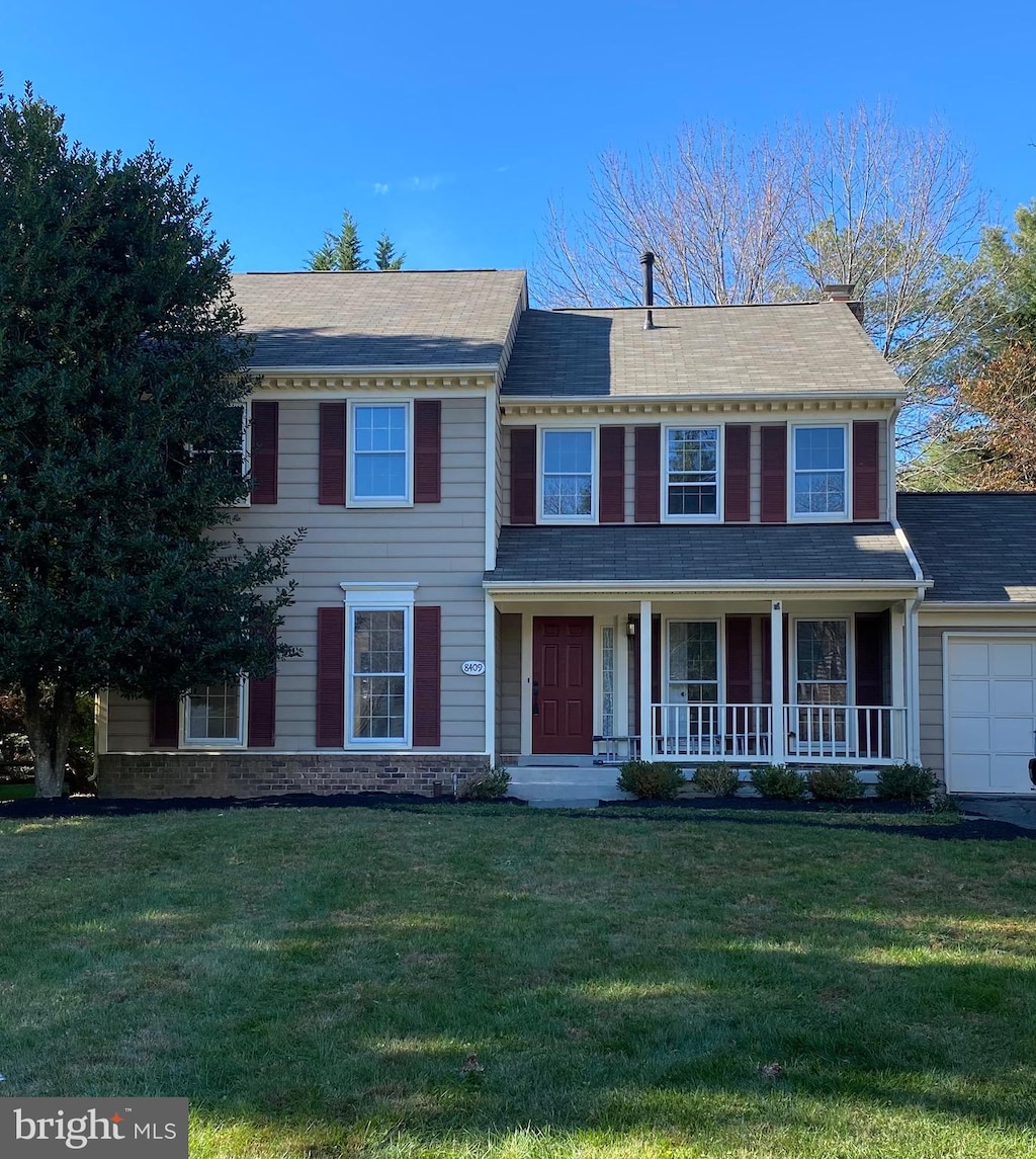 view of front of home with a front lawn and a porch