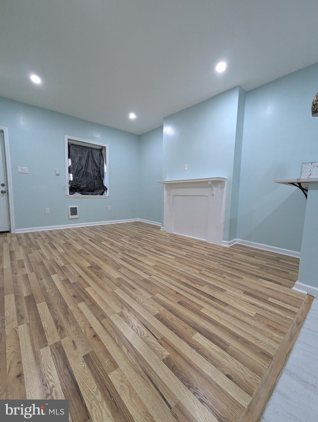 basement with light wood-type flooring