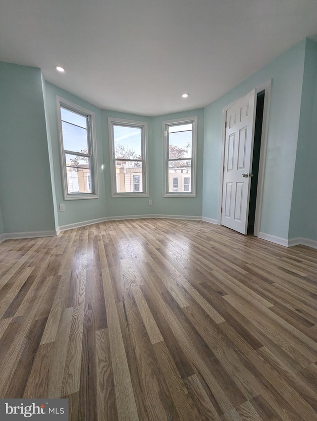 unfurnished room featuring dark hardwood / wood-style floors