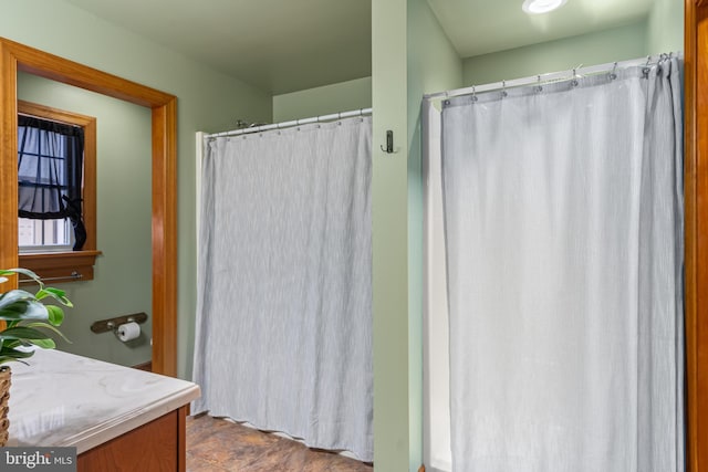 bathroom featuring curtained shower