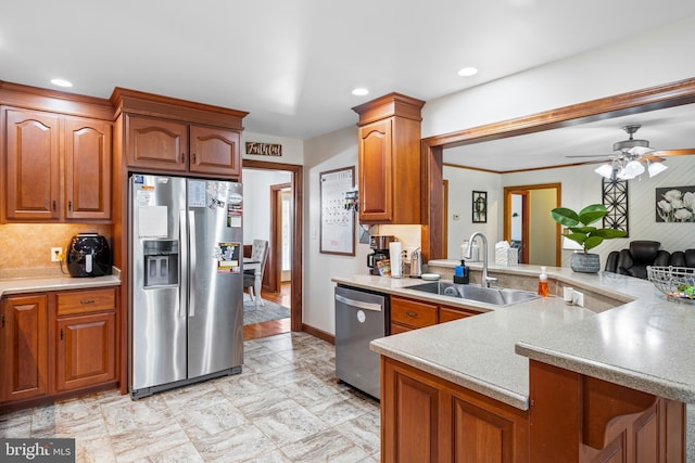 1060 Edwardsville Rd, Felton, DE 19943 - kitchen with appliances with stainless steel finishes, a sink, ceiling fan, light countertops, and a peninsula