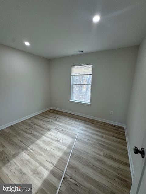 empty room featuring hardwood / wood-style flooring