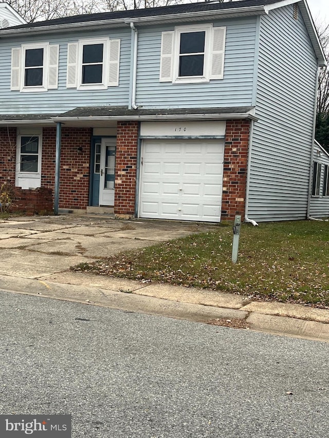 170 Channing Dr, Bear, DE 19701 - view of front facade with brick siding, an attached garage, and driveway