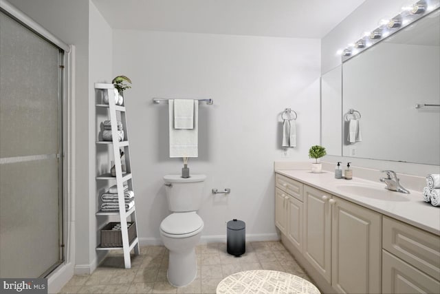 bathroom featuring toilet, vanity, tile patterned floors, and an enclosed shower