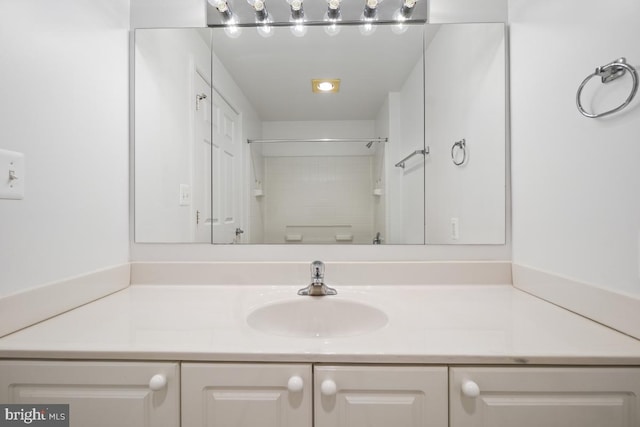 bathroom with vanity and walk in shower