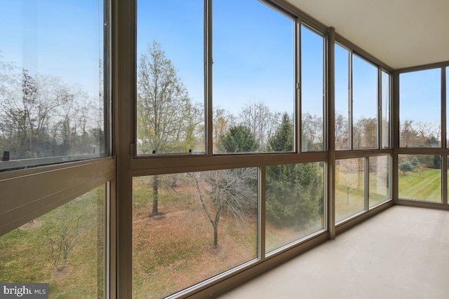 unfurnished sunroom with a wealth of natural light