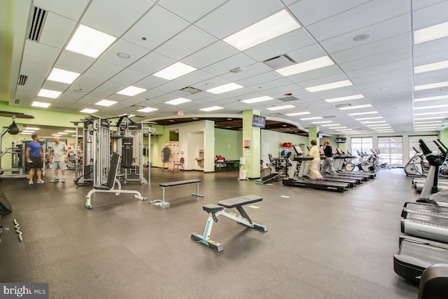 workout area featuring a drop ceiling