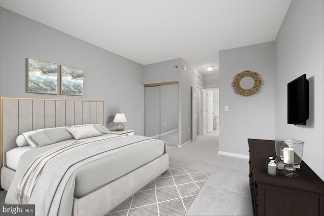 bedroom featuring light colored carpet and a closet