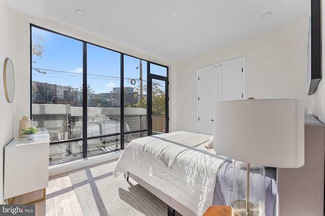 bedroom featuring a closet and light hardwood / wood-style floors