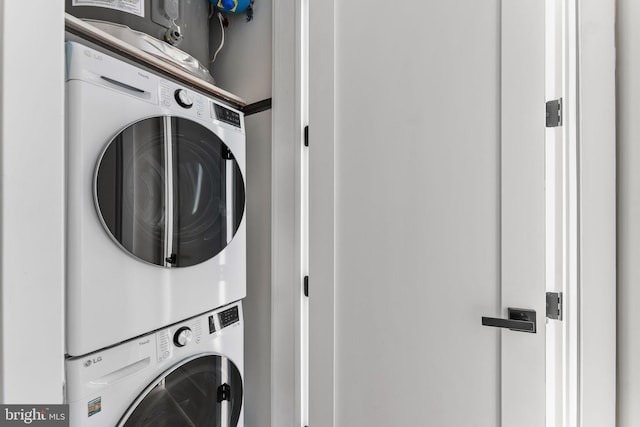 washroom with stacked washer and clothes dryer