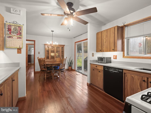 kitchen with dishwasher, dark wood-type flooring, white range oven, decorative light fixtures, and ceiling fan with notable chandelier