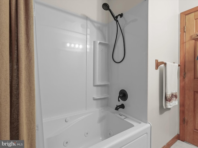 bathroom featuring shower / tub combo with curtain