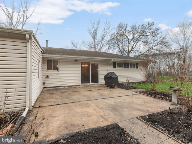 rear view of property with a patio area