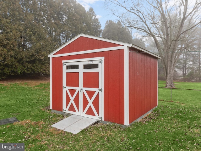 view of outdoor structure with a yard