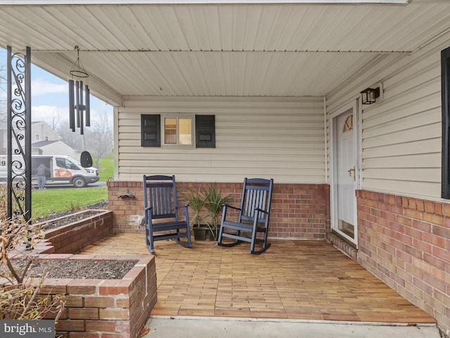 view of patio featuring a porch