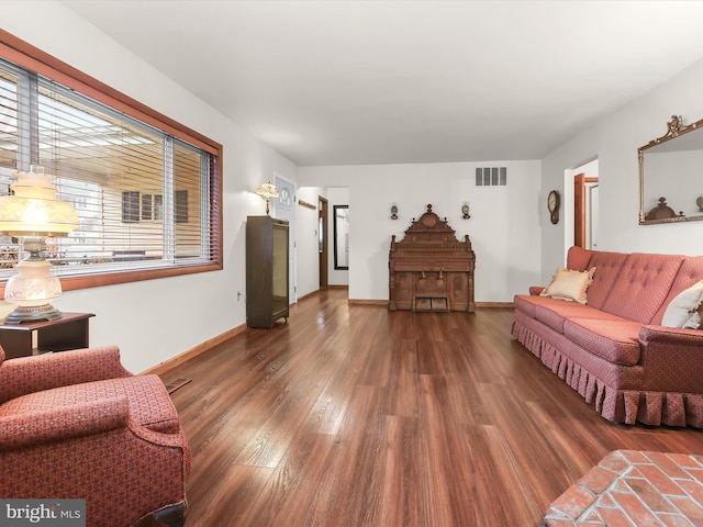 living room featuring dark hardwood / wood-style floors