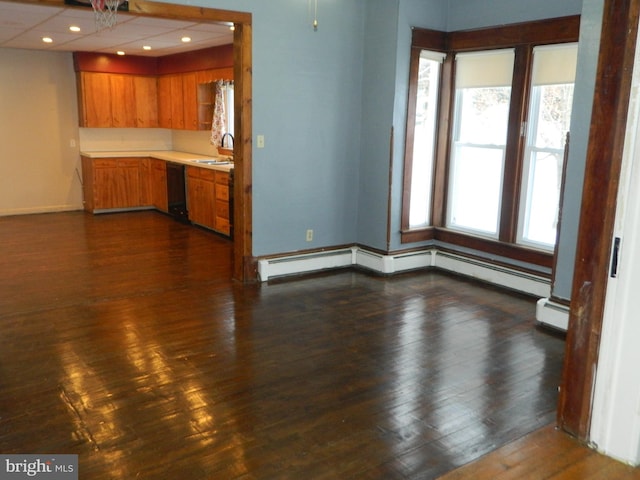 kitchen with dark hardwood / wood-style floors, sink, a wealth of natural light, and a baseboard radiator