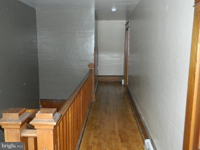 hall with dark hardwood / wood-style floors