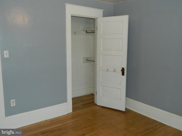 unfurnished bedroom featuring hardwood / wood-style floors