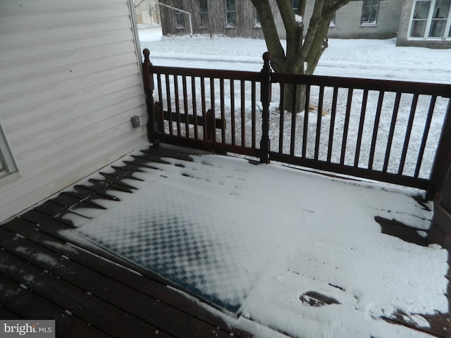 view of snow covered deck