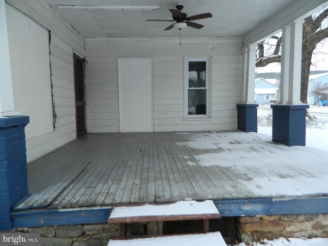 snow covered deck featuring ceiling fan