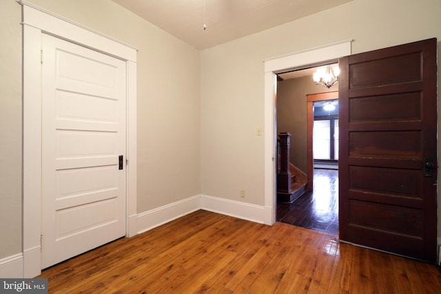 empty room featuring dark wood-type flooring