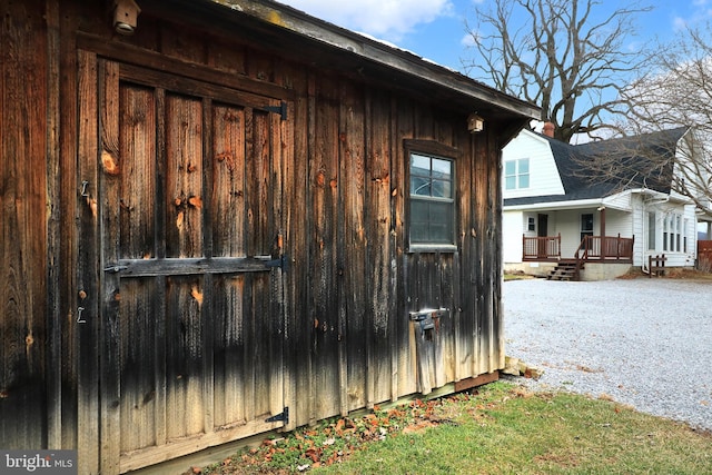 view of property exterior featuring covered porch