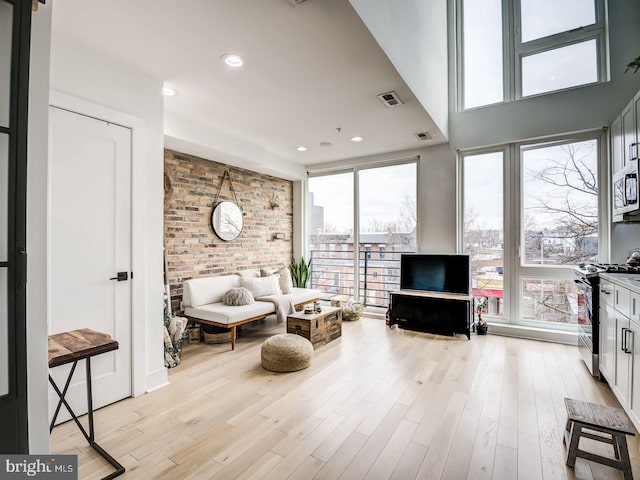 living area with light hardwood / wood-style flooring