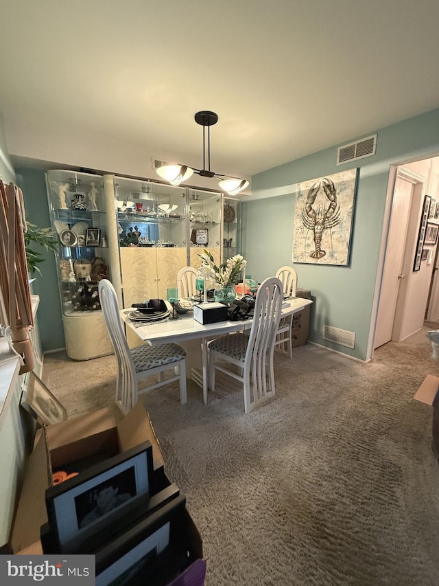 view of carpeted dining area