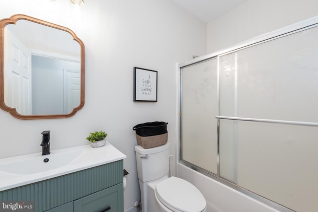 full bathroom featuring vanity, toilet, and enclosed tub / shower combo