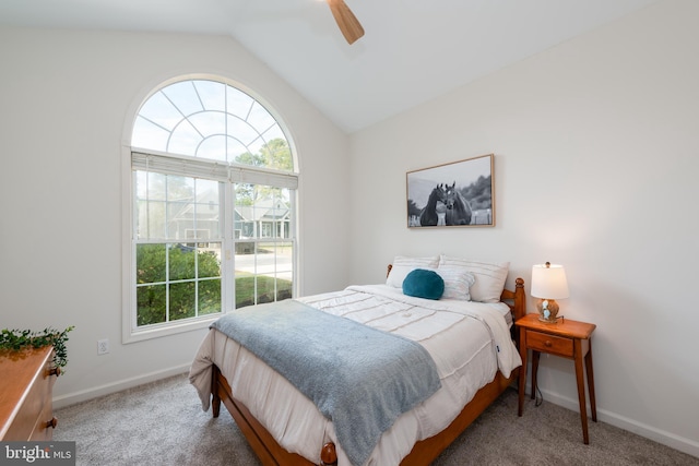 bedroom with carpet flooring, vaulted ceiling, and ceiling fan