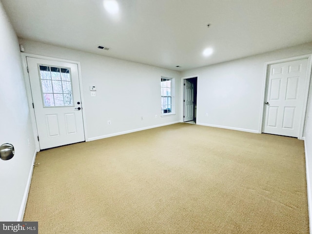 spare room with light carpet