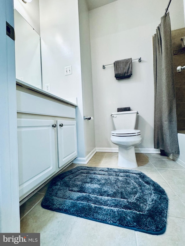 bathroom featuring tile patterned floors, shower / bath combo, and toilet