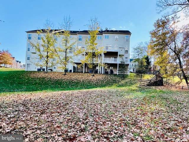 rear view of house with a lawn