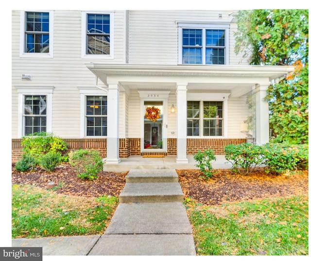 property entrance featuring covered porch