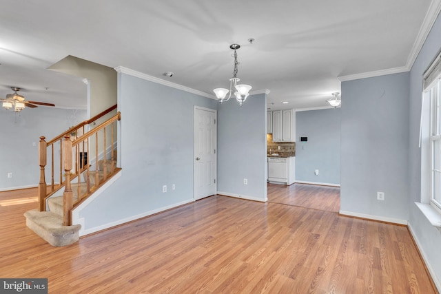 unfurnished living room with ornamental molding, ceiling fan with notable chandelier, and light wood-type flooring