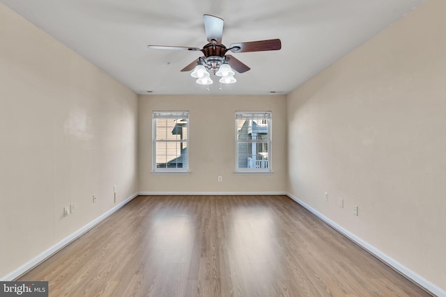 empty room with ceiling fan and light wood-type flooring