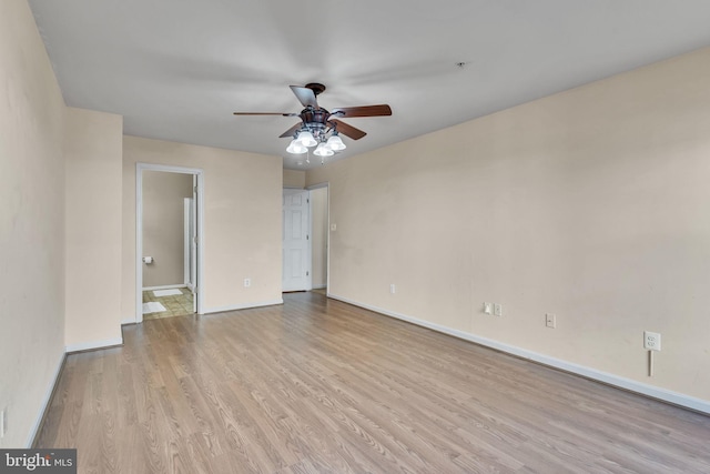 unfurnished room featuring ceiling fan and light wood-type flooring