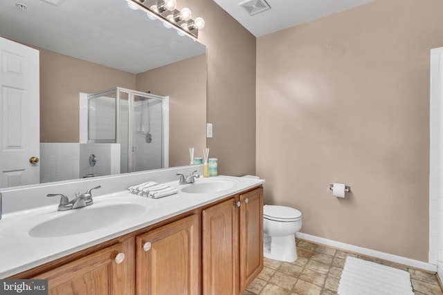 bathroom featuring vanity, toilet, and walk in shower